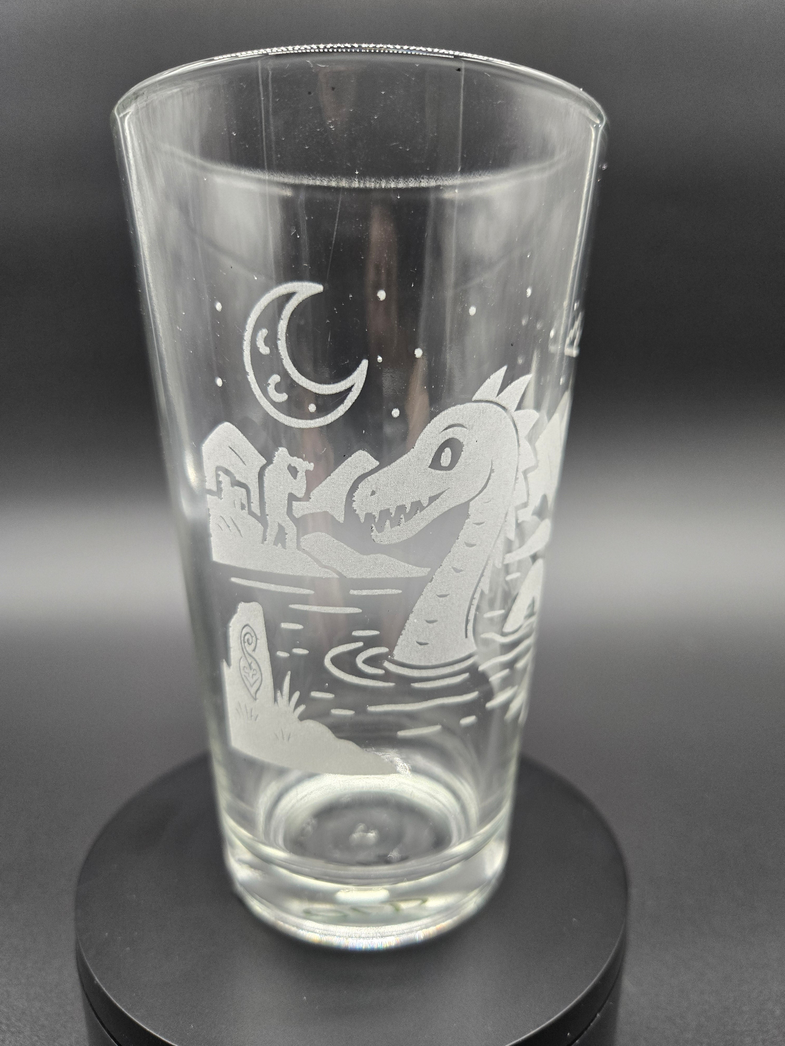 Engraved bar glass with Loch Ness Monster cryptid design by Frozen Forge