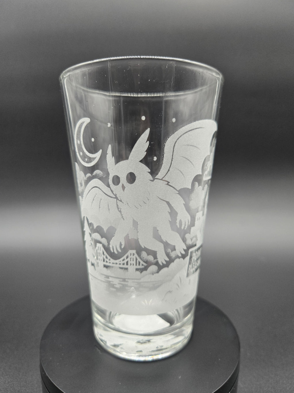 Engraved bar glass with Mothman cryptid design by Frozen Forge