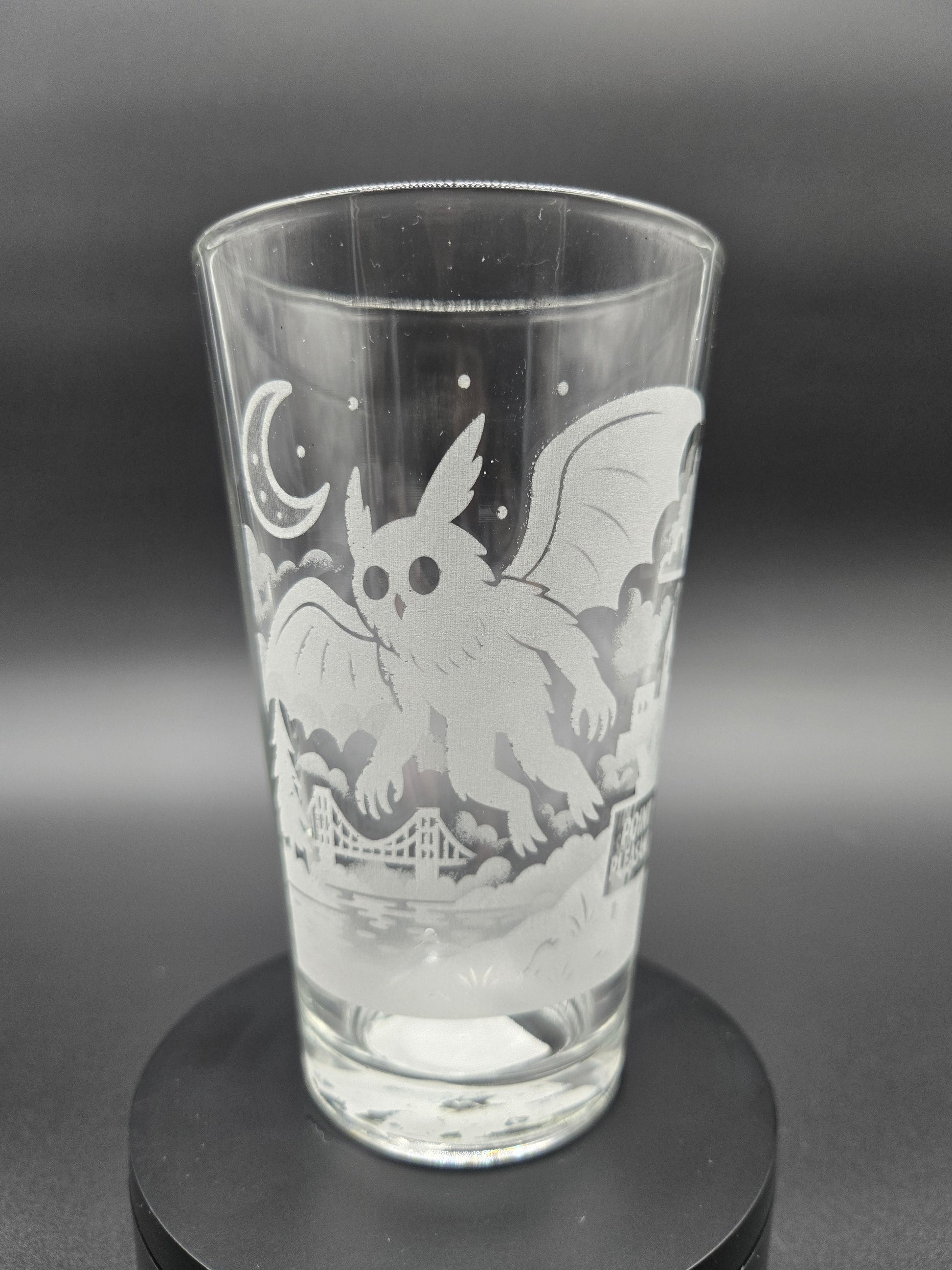 Engraved bar glass with Mothman cryptid design by Frozen Forge