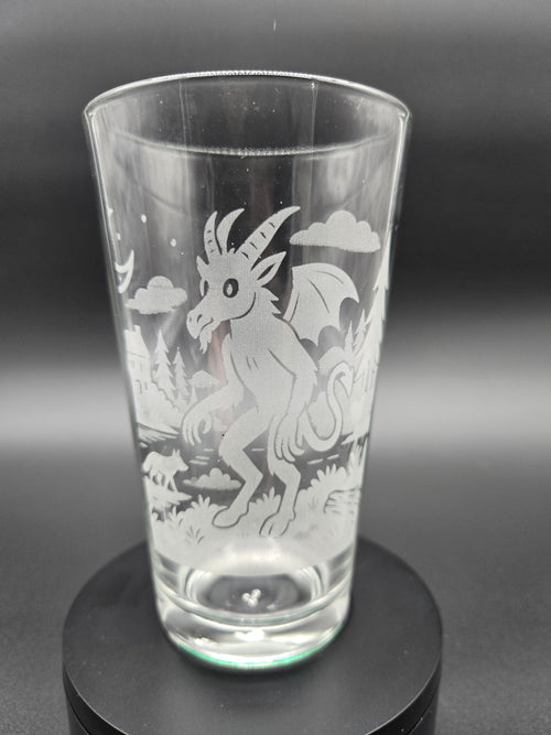 Engraved bar glass featuring Jersey Devil cryptid design by Frozen Forge