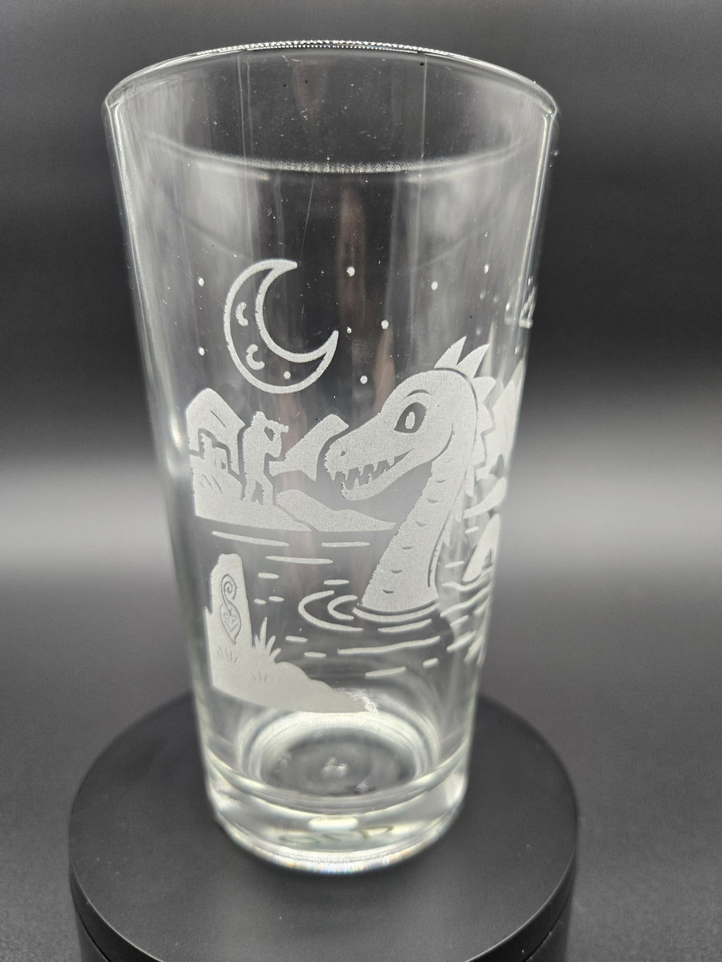 Engraved bar glass with Loch Ness Monster cryptid design by Frozen Forge
