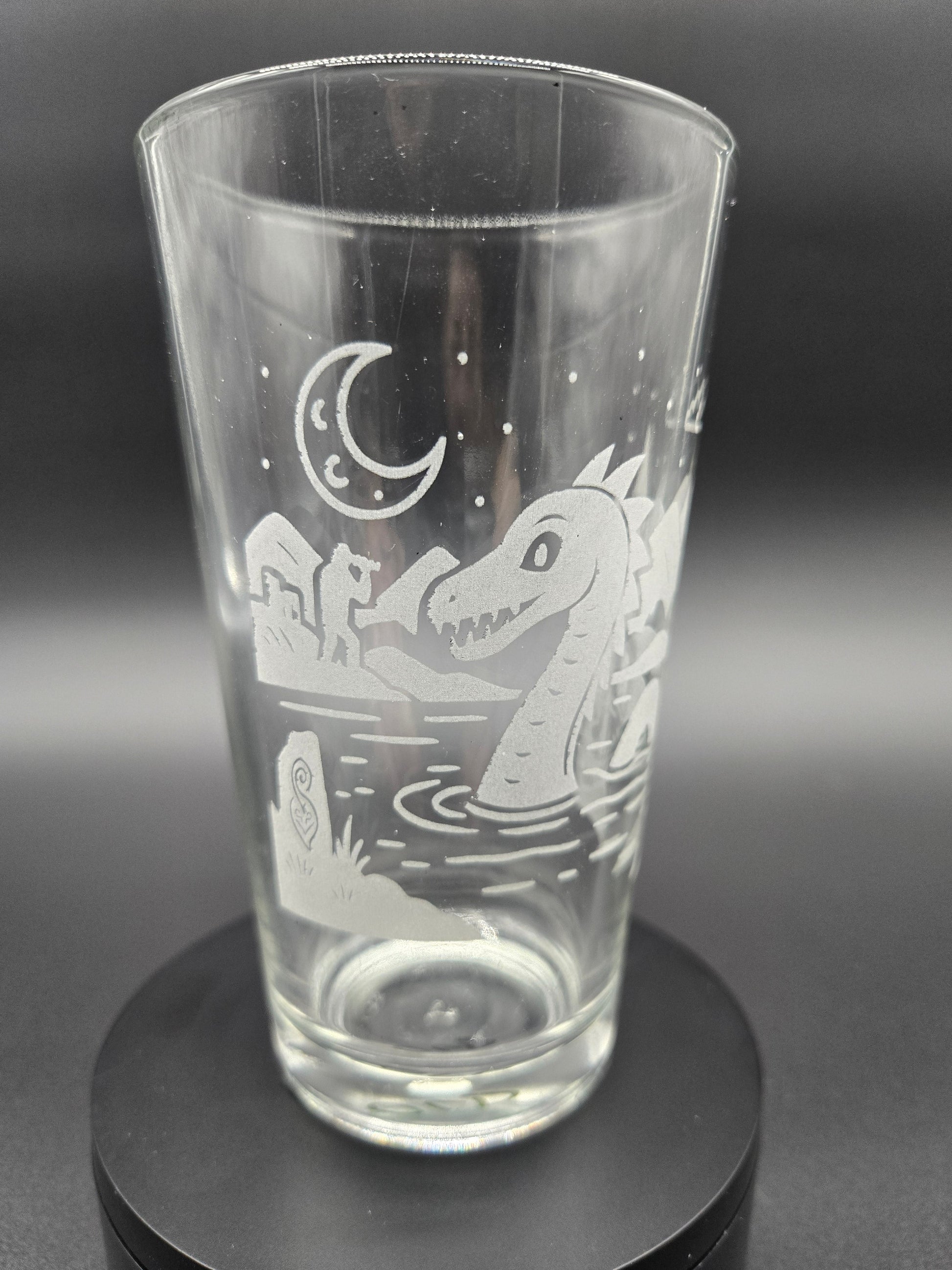Engraved bar glass with Loch Ness Monster cryptid design by Frozen Forge
