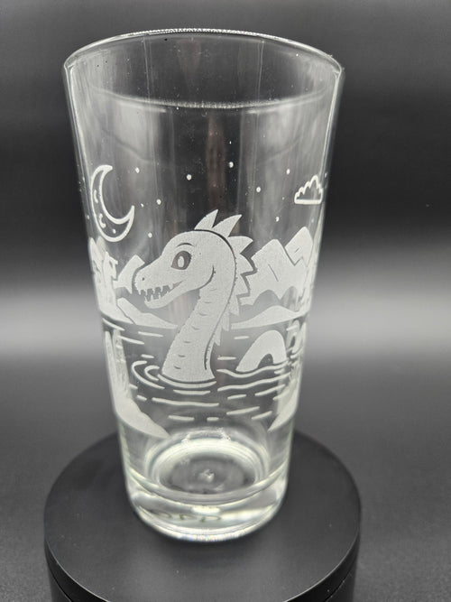 Engraved bar glass with Loch Ness Monster cryptid design by Frozen Forge