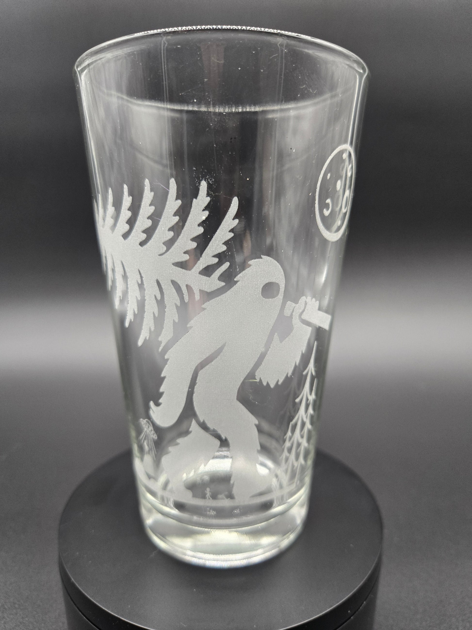 Engraved bar glass with Bigfoot cryptid design by Frozen Forge