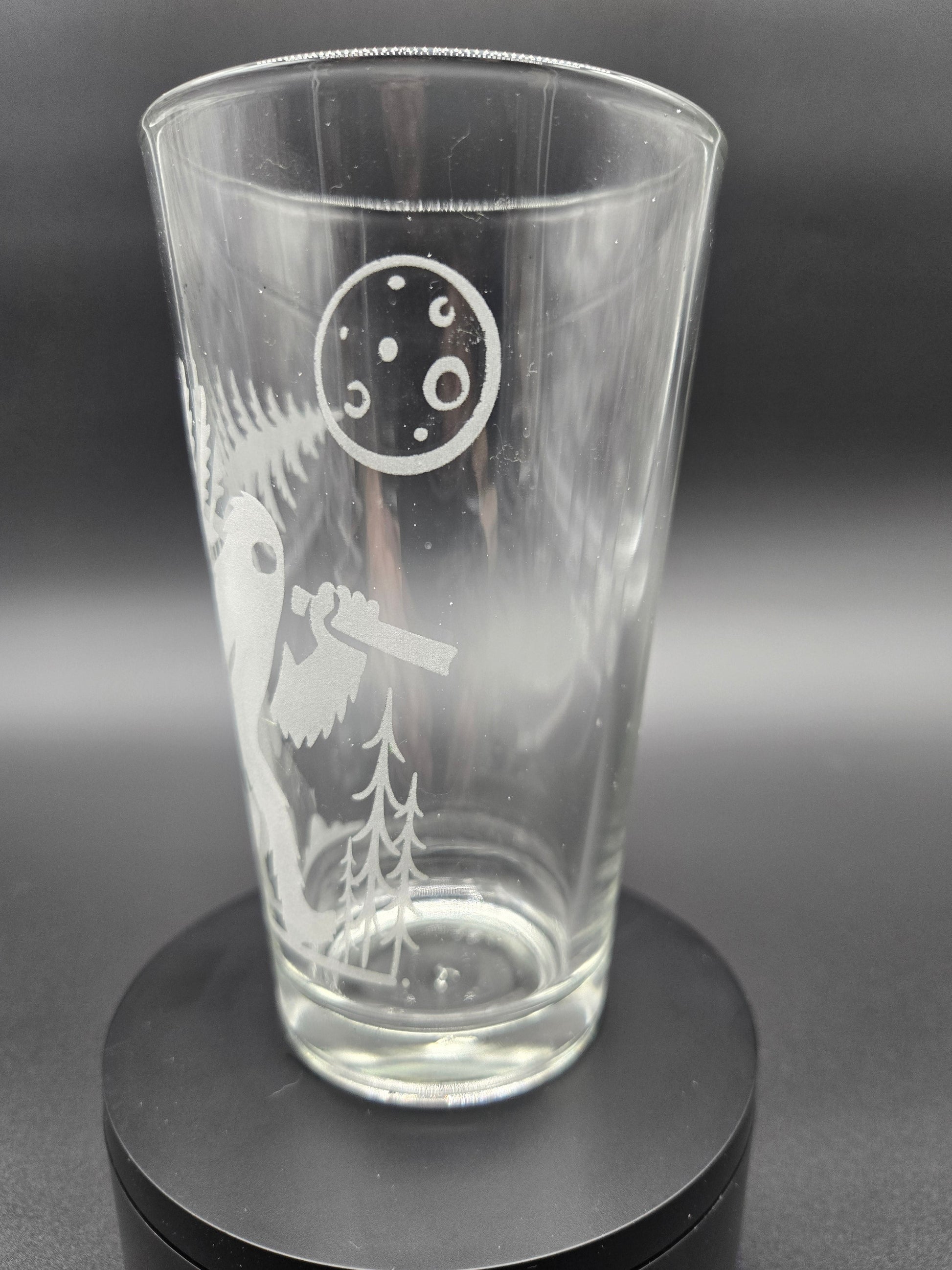 Engraved bar glass with Bigfoot cryptid design by Frozen Forge