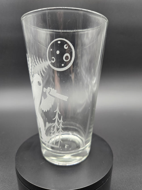 Engraved bar glass with Bigfoot cryptid design by Frozen Forge