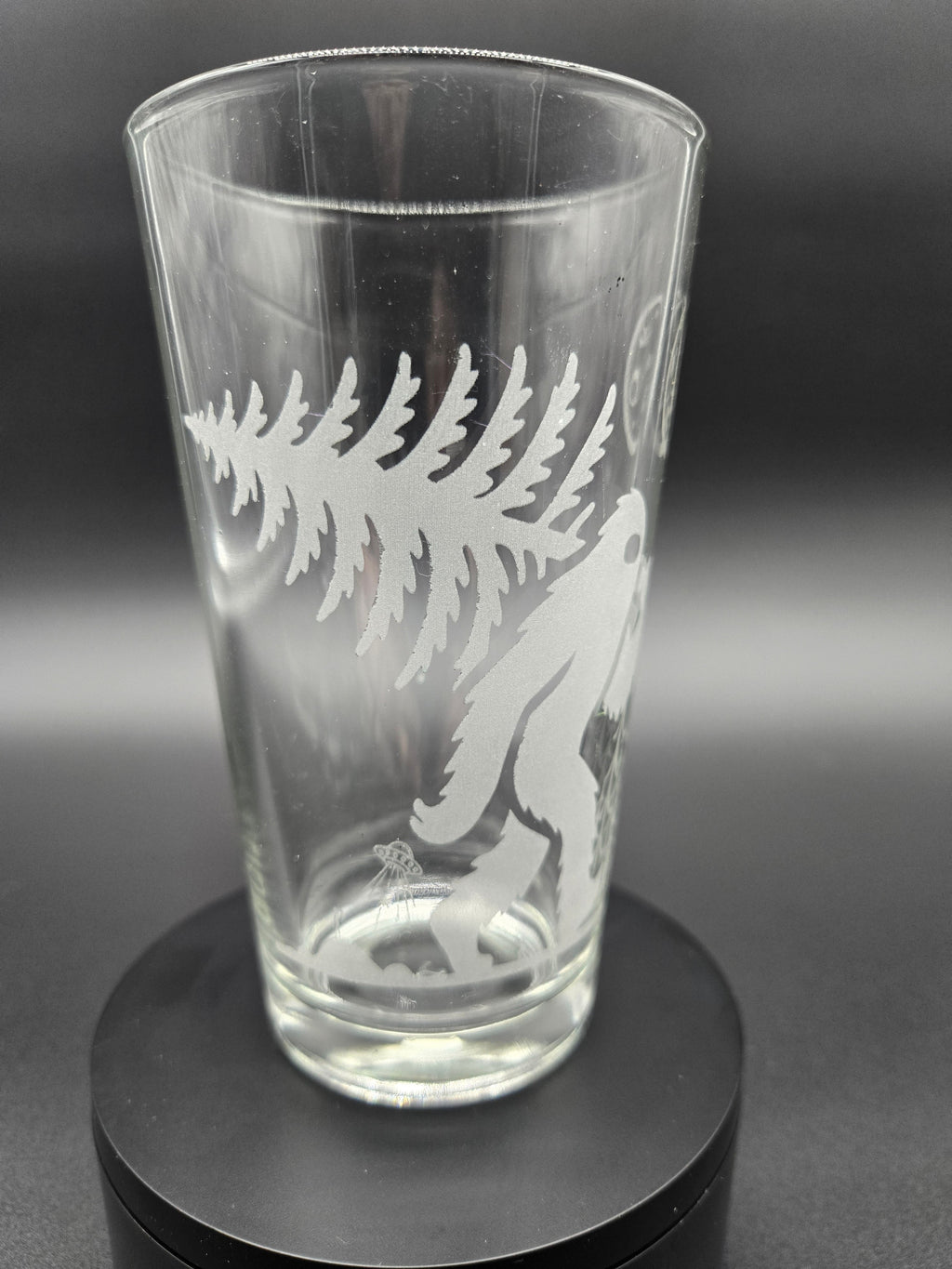 Engraved bar glass with Bigfoot cryptid design by Frozen Forge