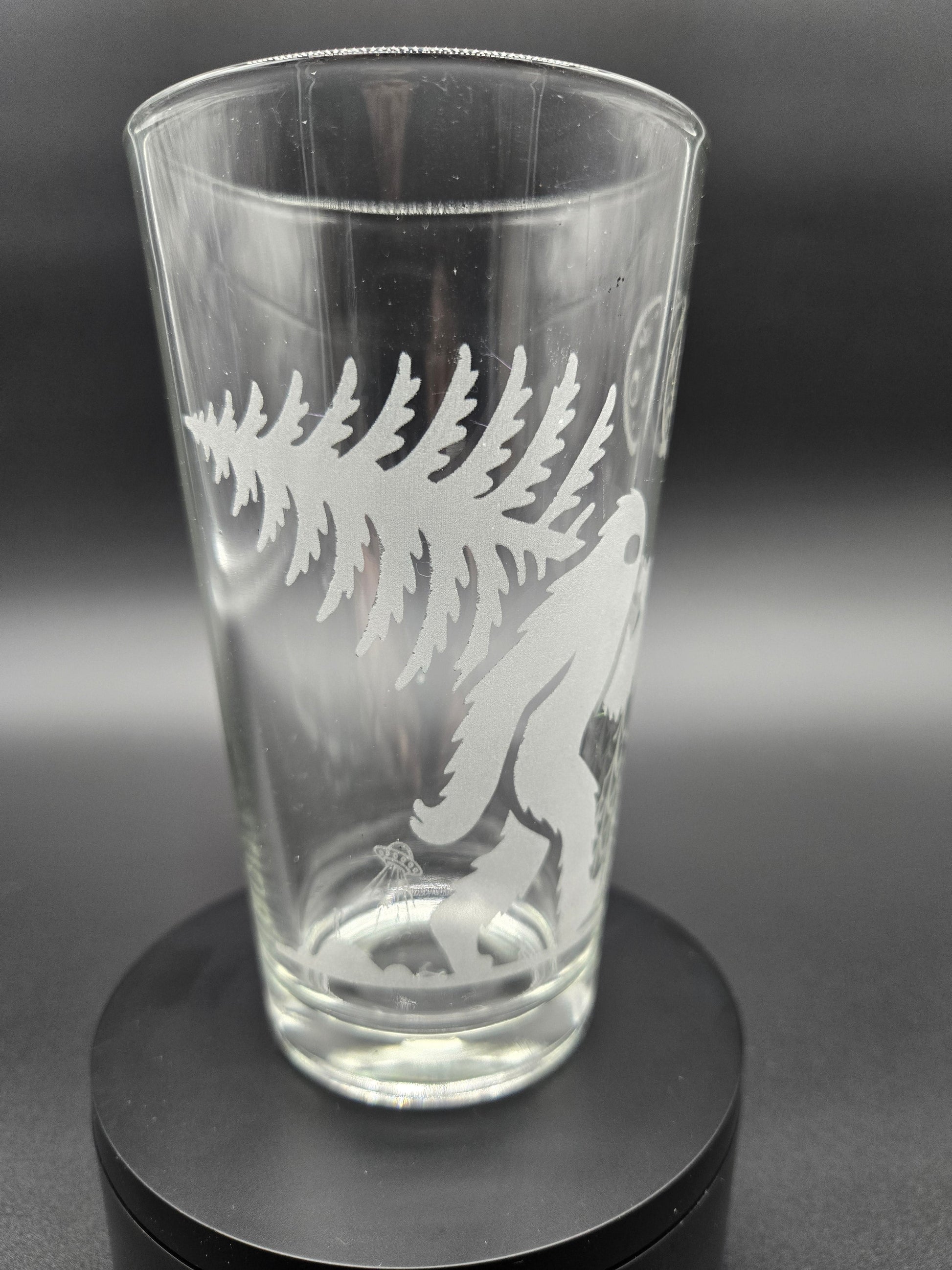 Engraved bar glass with Bigfoot cryptid design by Frozen Forge