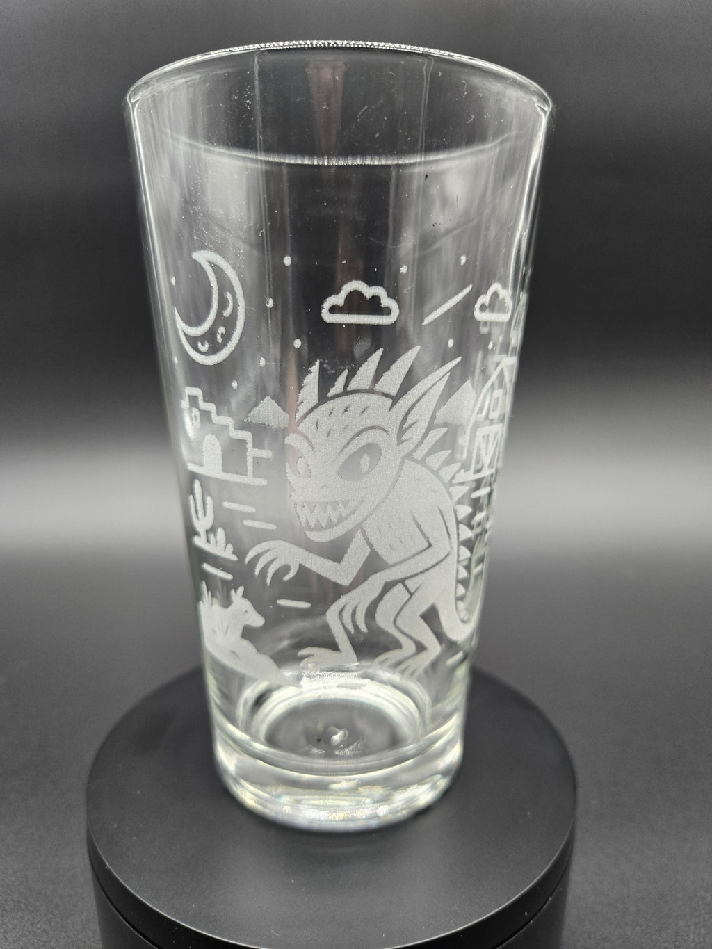 Engraved bar glass with Chupacabra cryptid design by Frozen Forge