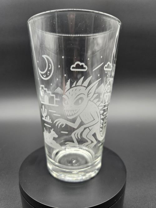 Engraved bar glass with Chupacabra cryptid design by Frozen Forge