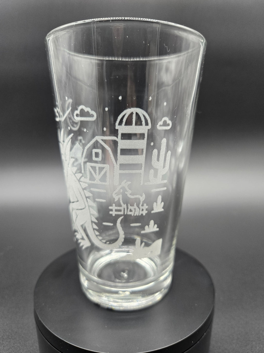 Engraved bar glass with Chupacabra cryptid design by Frozen Forge