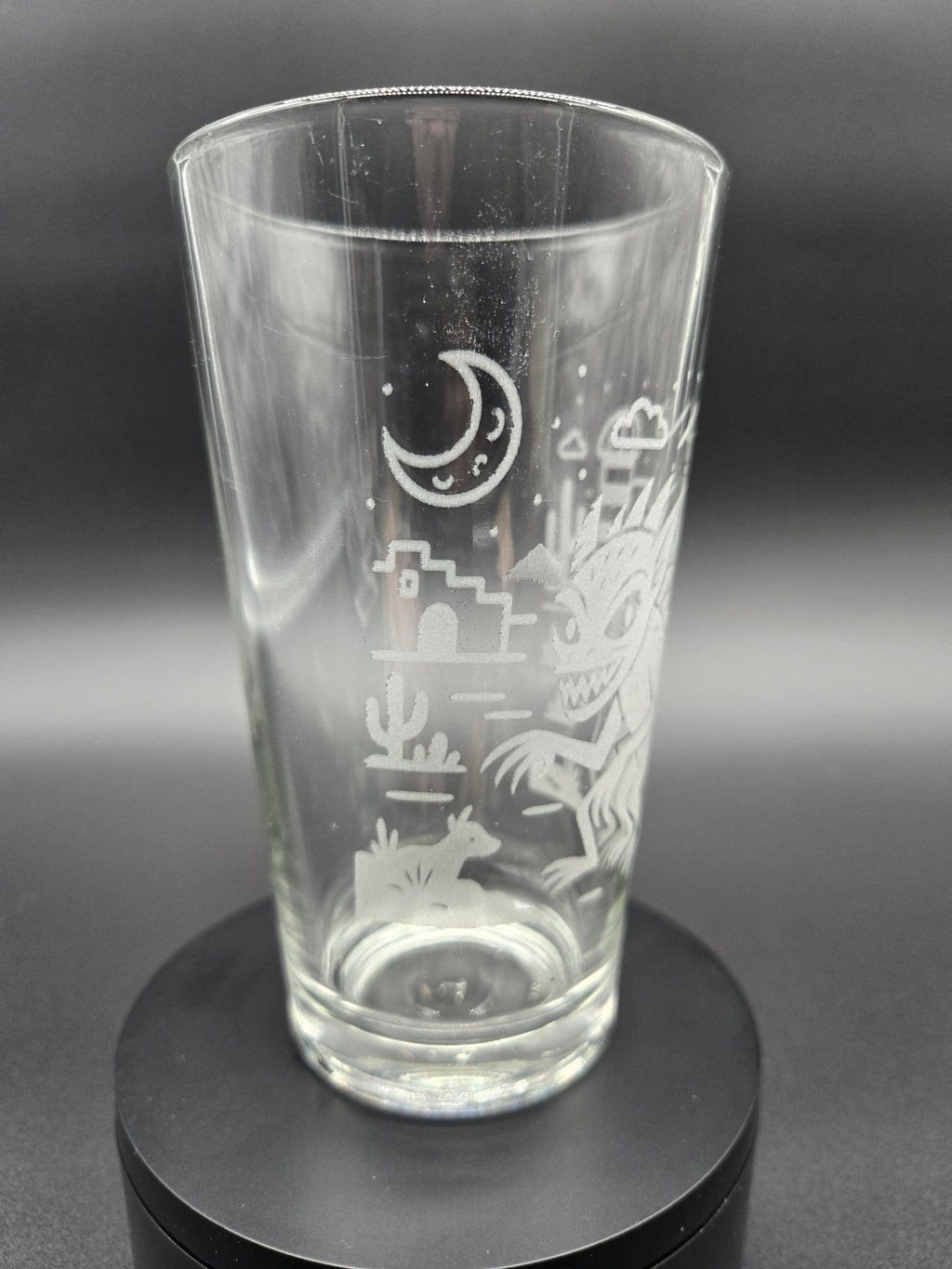 Engraved bar glass with Chupacabra cryptid design by Frozen Forge
